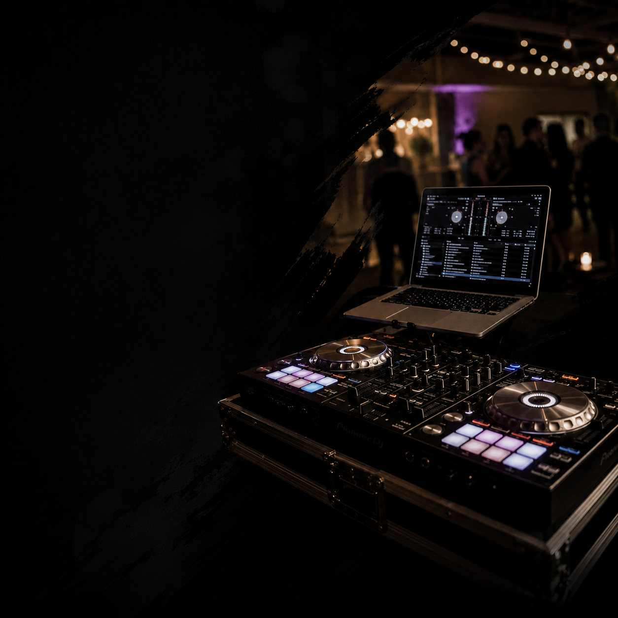Pioneer DJ controller with laptop at an outdoor night event